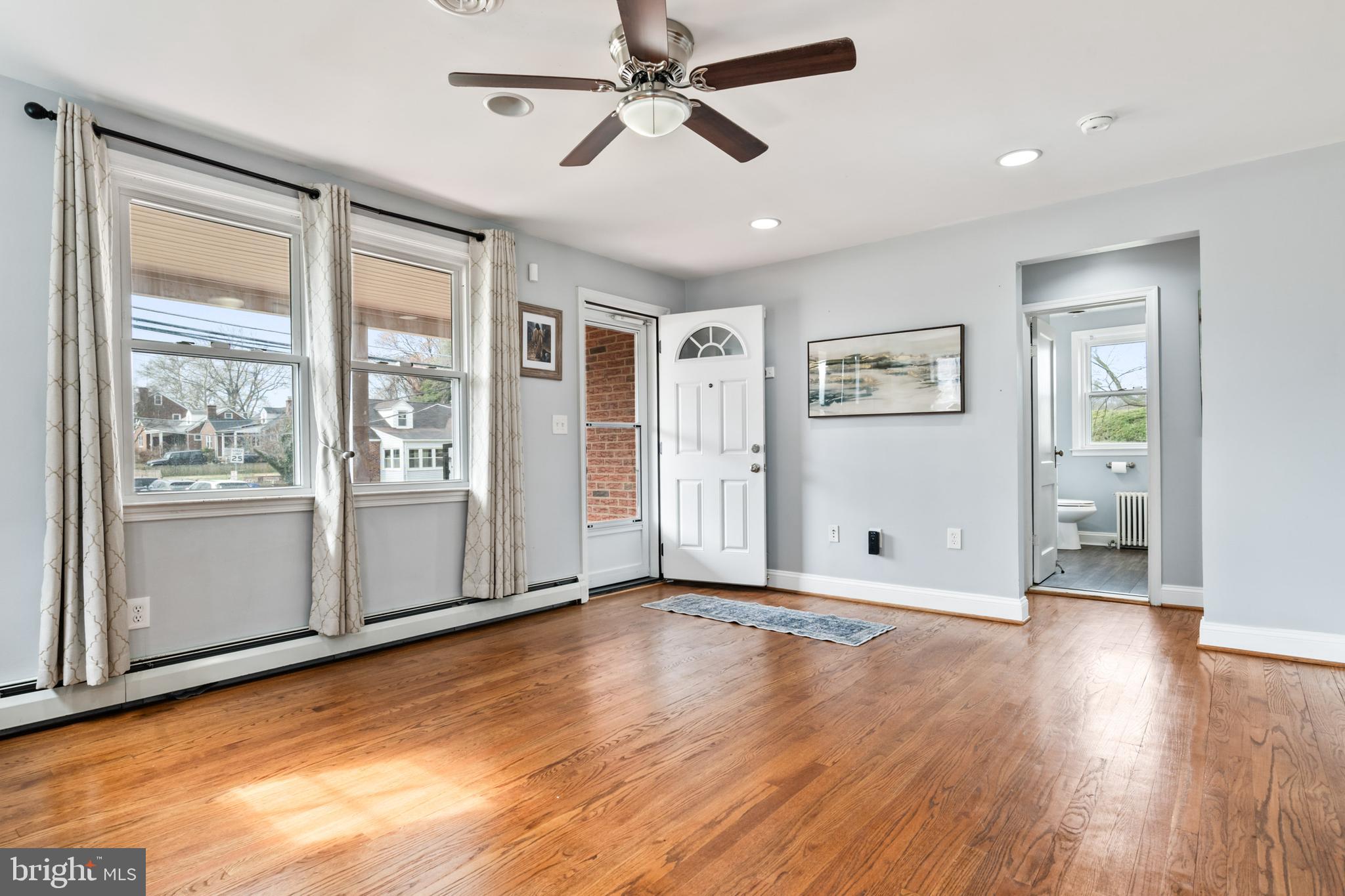 4416 Fullerton Avenue Nottingham, MD 21236 - Photo 9 of 70 a view of empty room with wooden floor and fan