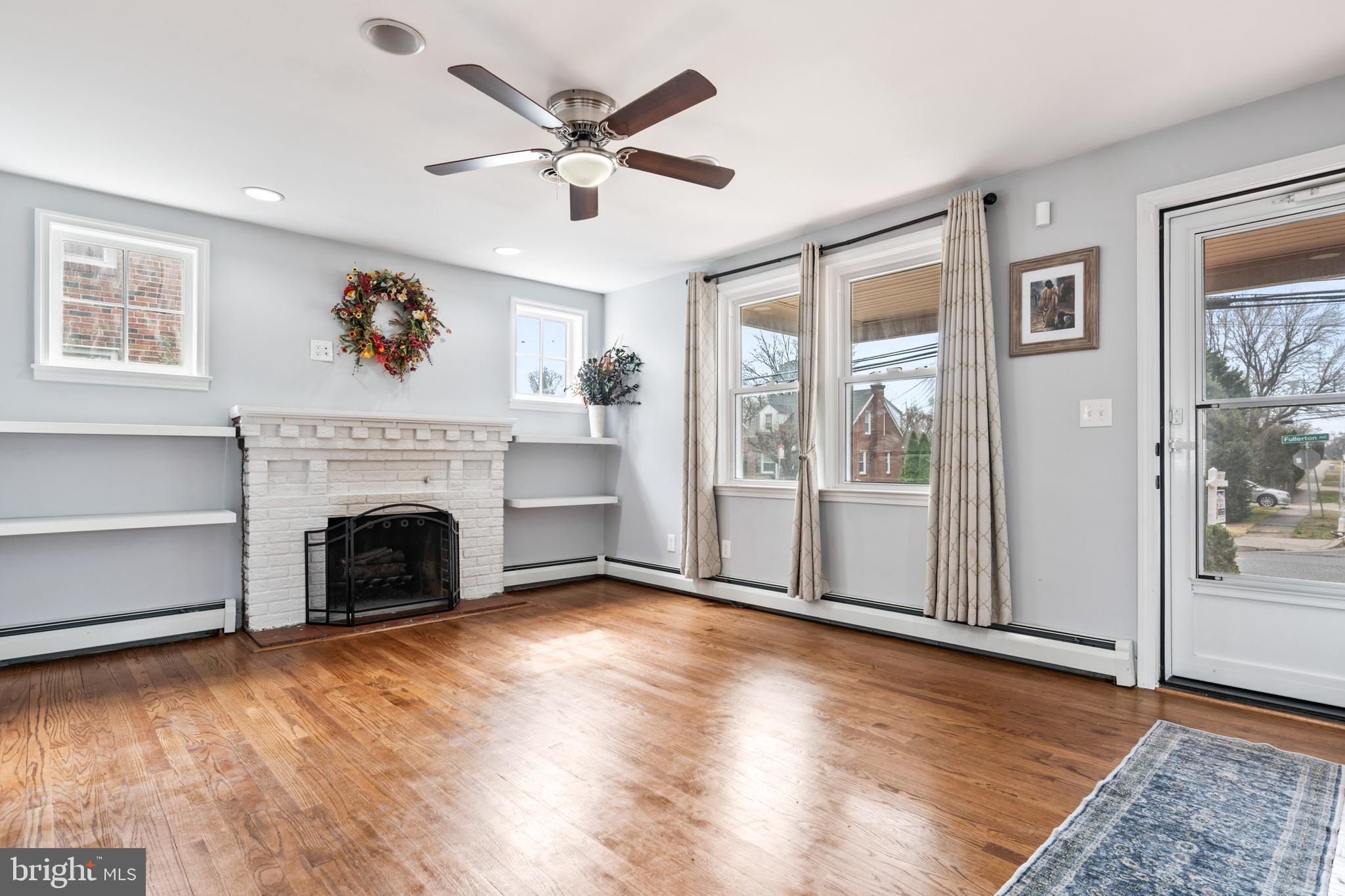 4416 Fullerton Avenue Nottingham, MD 21236 - Photo 10 of 70 a view of a livingroom with a fireplace window and wooden floor