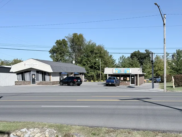 a view of a street with a building in the background