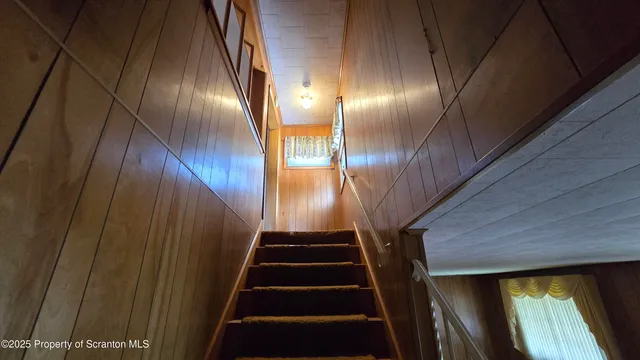 a kitchen with refrigerator and cabinets