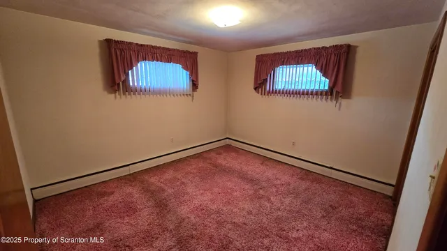 an empty room with a hallway