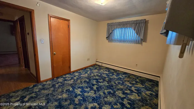 a view of a hallway with staircase