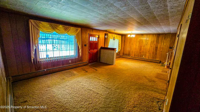 a view of an empty room and window