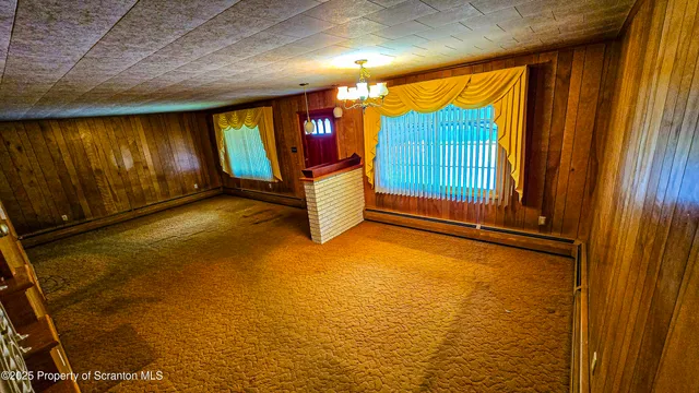 a bathroom with a toilet and a shower curtain