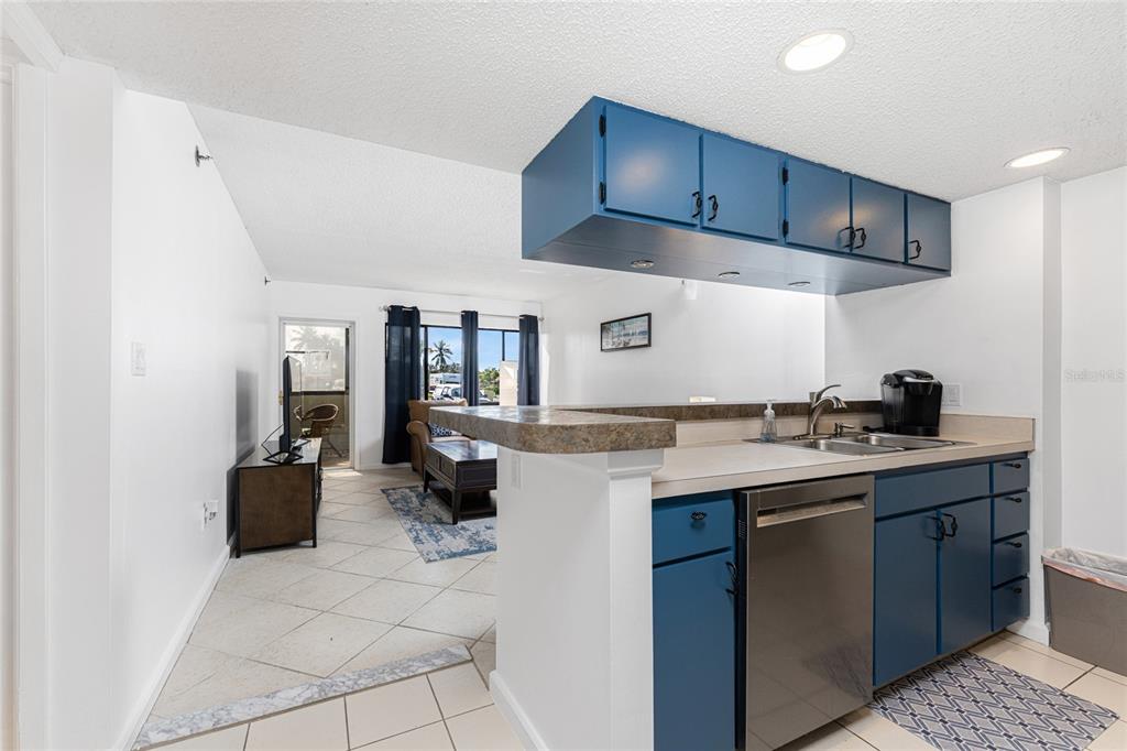 3170 Matecumbe Key Road, Unit 115 Punta Gorda, FL 33955 - Photo 11 of 59 a kitchen with a sink and cabinets