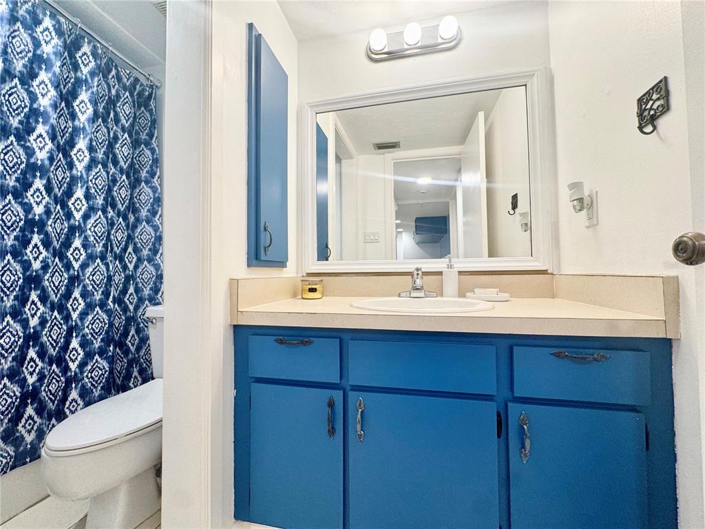 3170 Matecumbe Key Road, Unit 115 Punta Gorda, FL 33955 - Photo 16 of 43 a bathroom with a sink and a mirror
