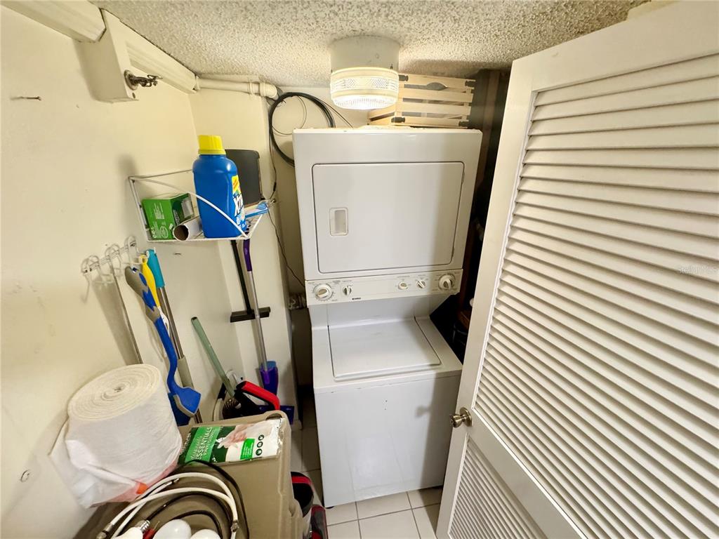 3170 Matecumbe Key Road, Unit 115 Punta Gorda, FL 33955 - Photo 18 of 43 a utility room with dryer and washer