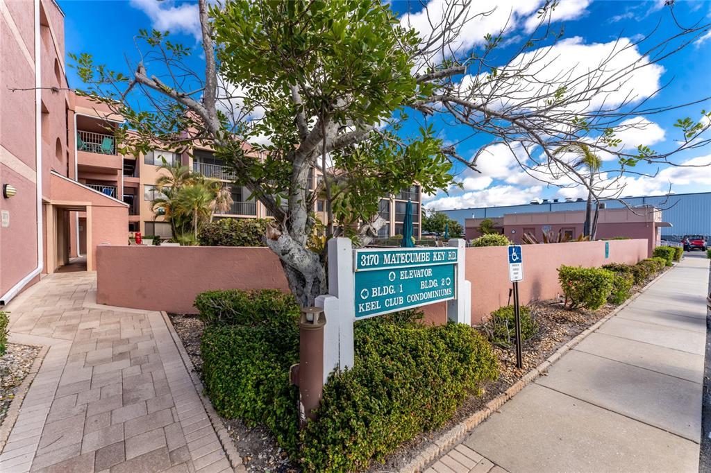 3170 Matecumbe Key Road, Unit 115 Punta Gorda, FL 33955 - Photo 2 of 59 a front view of a building with a tree