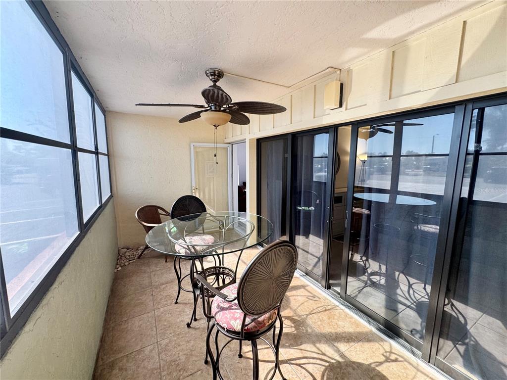 3170 Matecumbe Key Road, Unit 115 Punta Gorda, FL 33955 - Photo 21 of 43 a view of a room with table and chairs