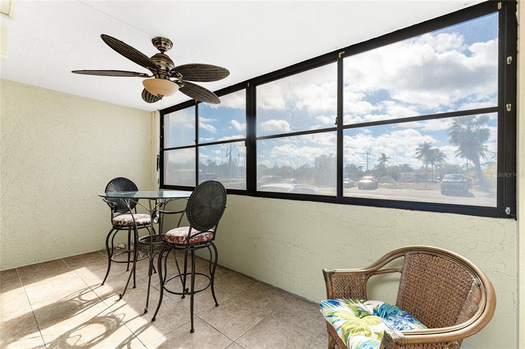 3170 Matecumbe Key Road, Unit 115 Punta Gorda, FL 33955 - Photo 22 of 59 a view of a dining room with furniture window and outside view