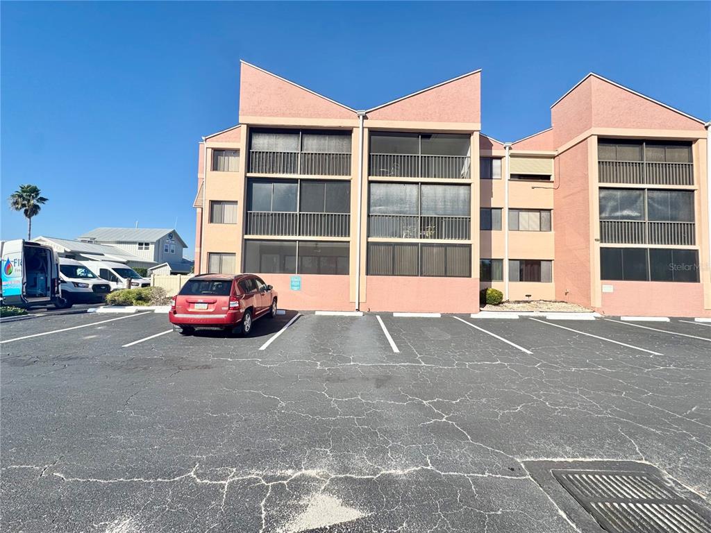 3170 Matecumbe Key Road, Unit 115 Punta Gorda, FL 33955 - Photo 24 of 43 a car parked in front of a building