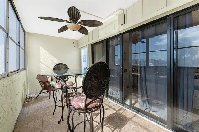 a view of a chairs and table in a patio