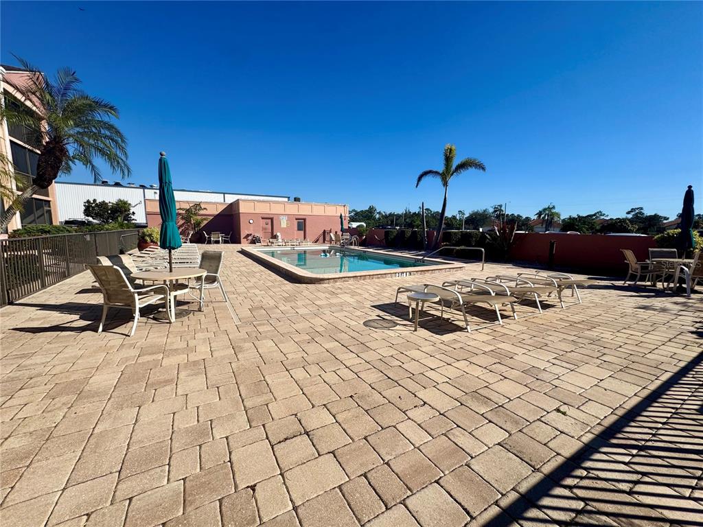 3170 Matecumbe Key Road, Unit 115 Punta Gorda, FL 33955 - Photo 29 of 43 a view of a terrace with chairs