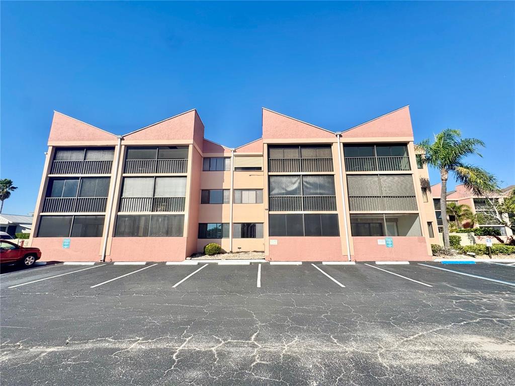 3170 Matecumbe Key Road, Unit 115 Punta Gorda, FL 33955 - Photo 3 of 43 a view of building with a street