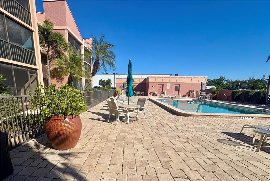 3170 Matecumbe Key Road, Unit 115 Punta Gorda, FL 33955 - Photo 31 of 43 a view of a terrace with chairs