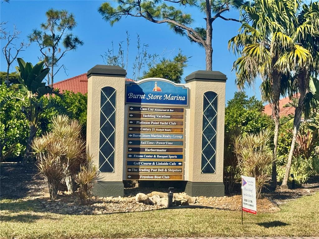 3170 Matecumbe Key Road, Unit 115 Punta Gorda, FL 33955 - Photo 34 of 43 a front view of a house with garden