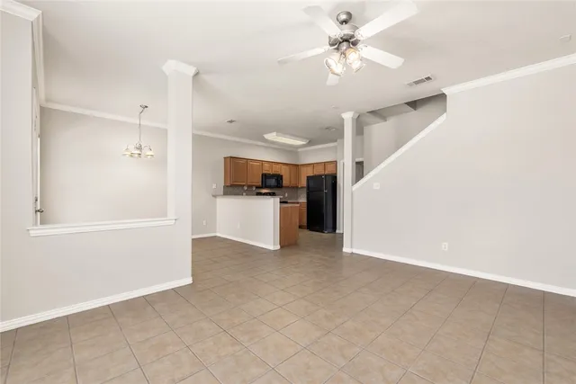 a view of a kitchen with a sink and a refrigerator