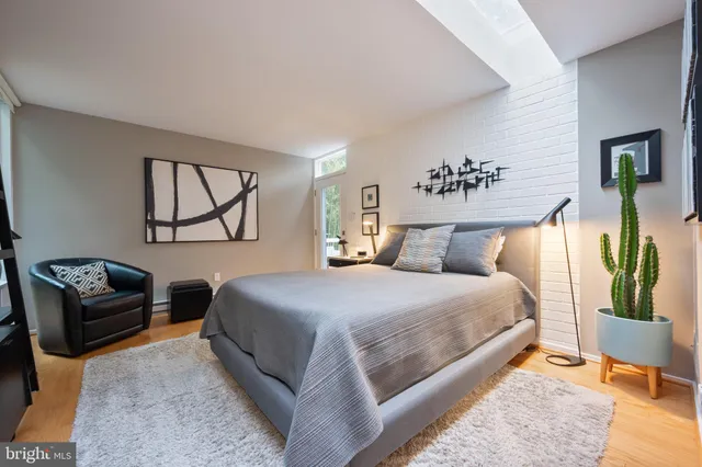 a bedroom with a large bed and a couch