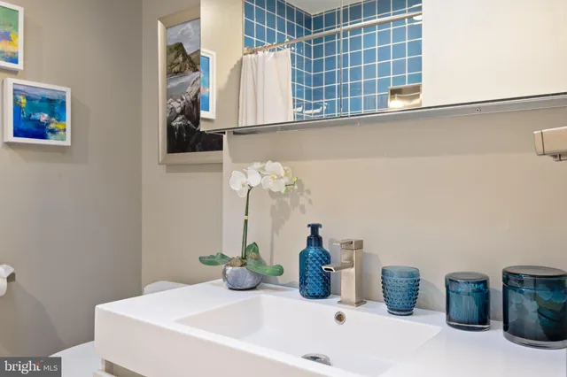 a bathroom with a sink and a window
