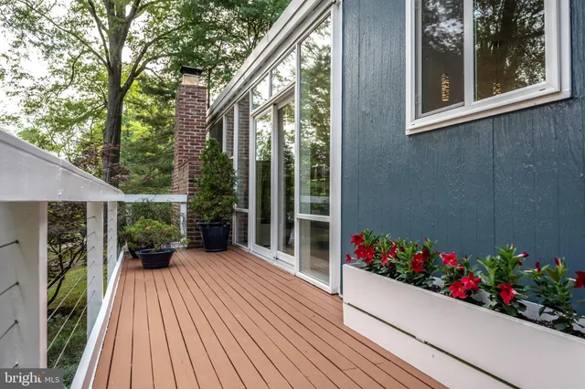 a view of a house with a flower garden