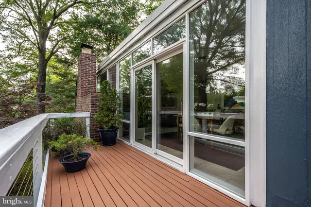a view of balcony with furniture and wooden floor