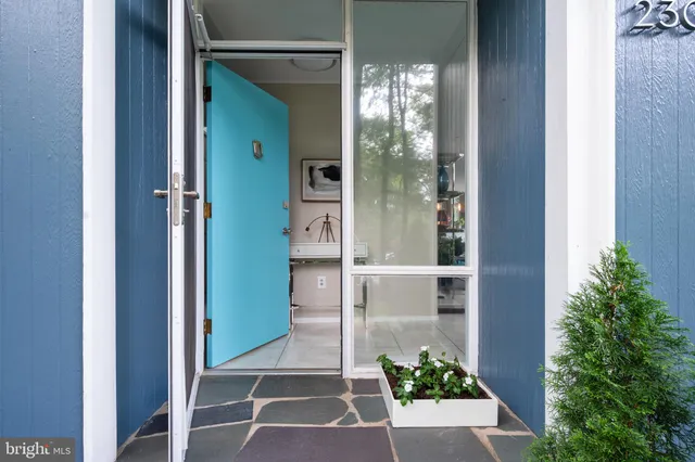 a room with a glass door and shower