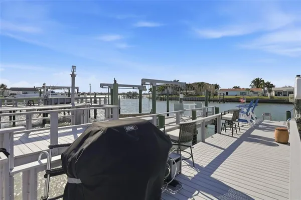 a view of a patio with couches table and chairs