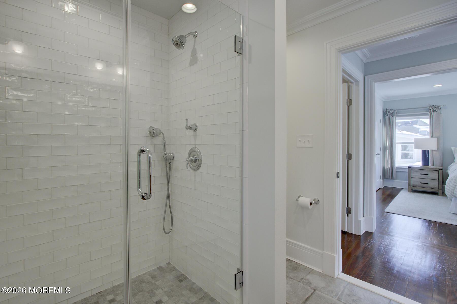 39 River Road Rumson, NJ 07760 - Photo 19 of 36 a bathroom with a glass shower door