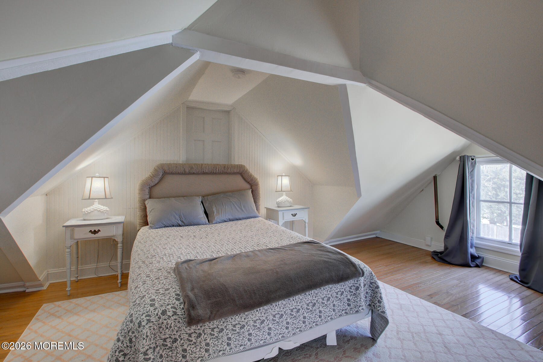 39 River Road Rumson, NJ 07760 - Photo 23 of 36 a bedroom with a large bed and a window
