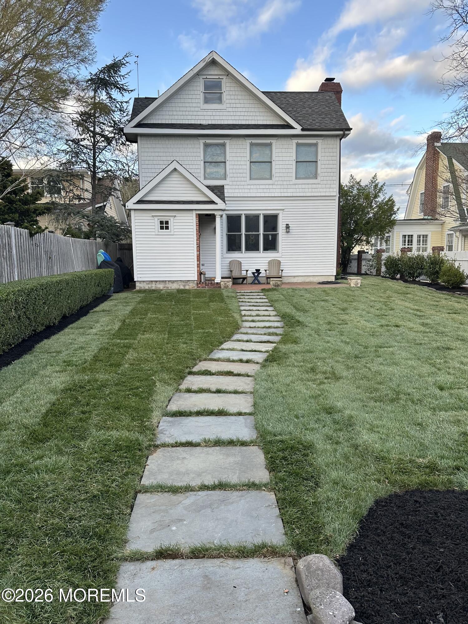 39 River Road Rumson, NJ 07760 - Photo 25 of 36 a front view of a house with a yard