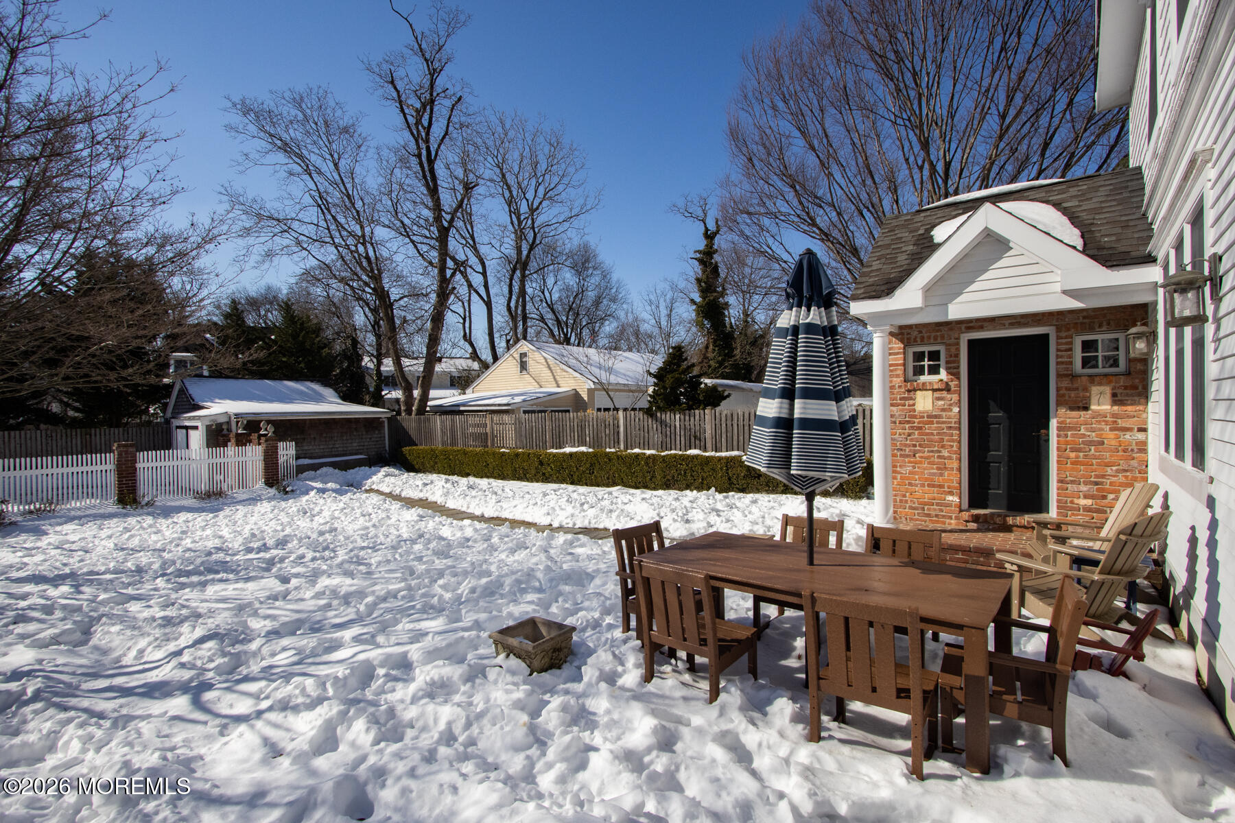 39 River Road Rumson, NJ 07760 - Photo 26 of 36 a view of a dinning table and chairs in the patio