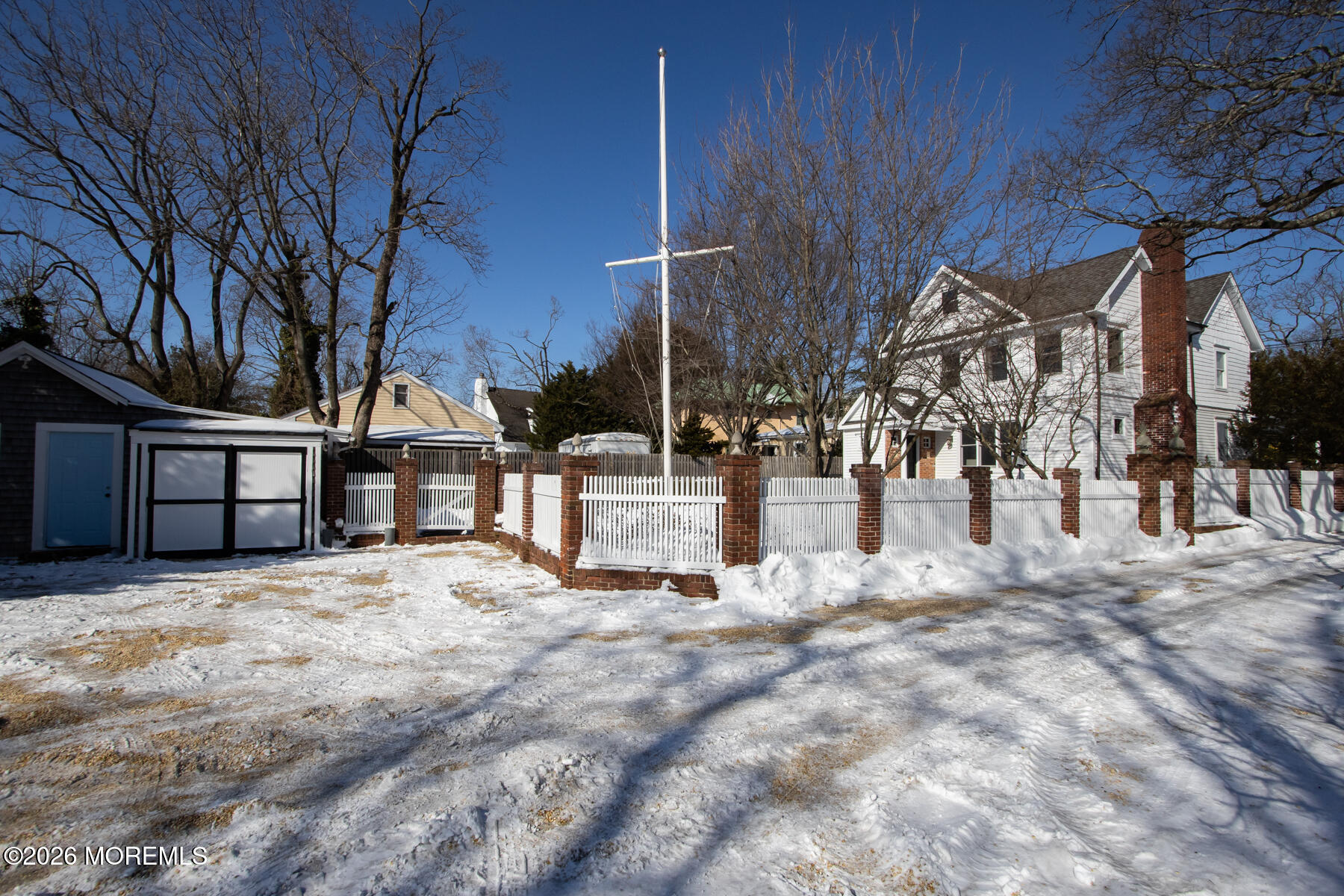 39 River Road Rumson, NJ 07760 - Photo 27 of 36 a view of a white house with a yard