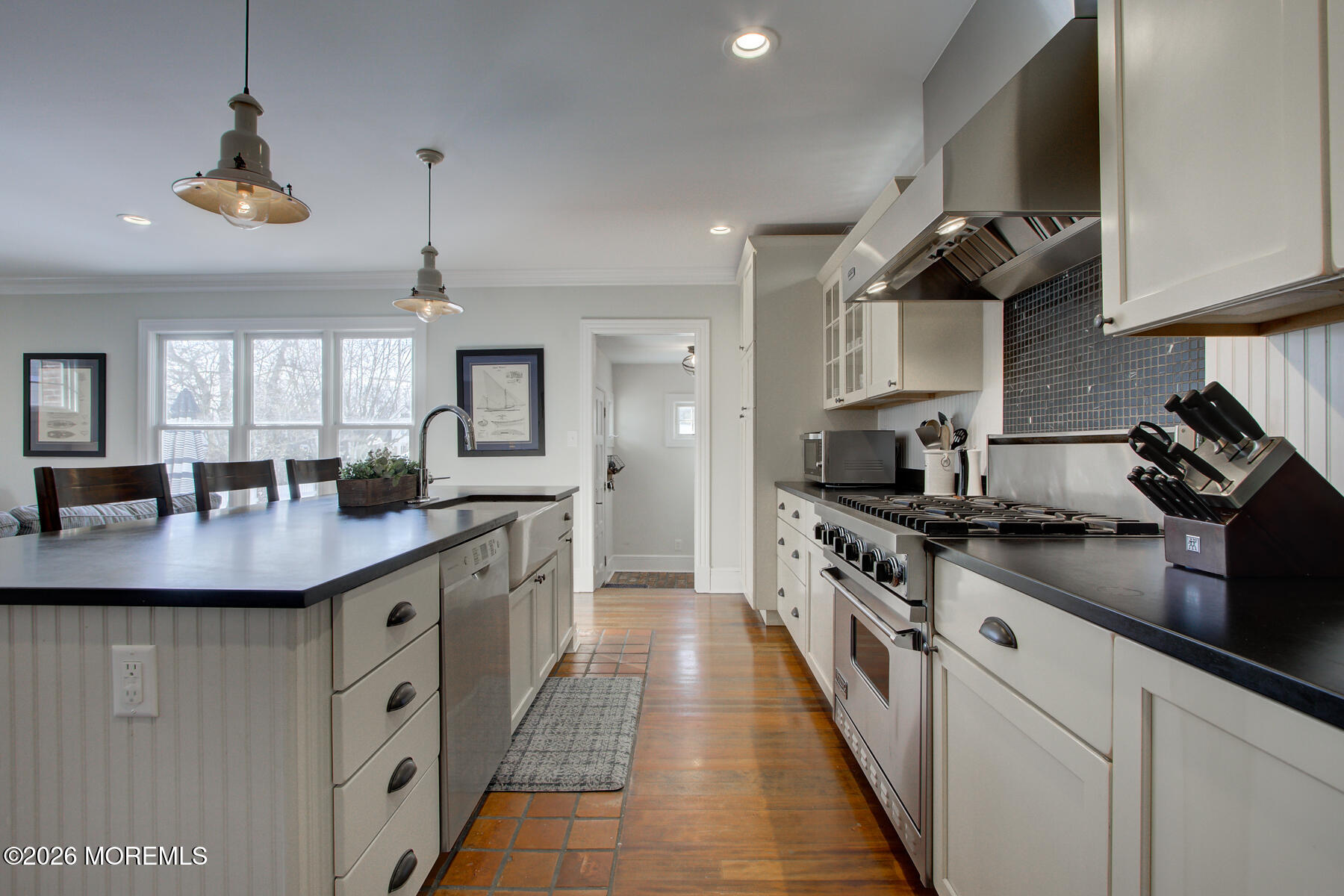39 River Road Rumson, NJ 07760 - Photo 7 of 36 a kitchen with stainless steel appliances granite countertop a sink a stove and a wooden floors