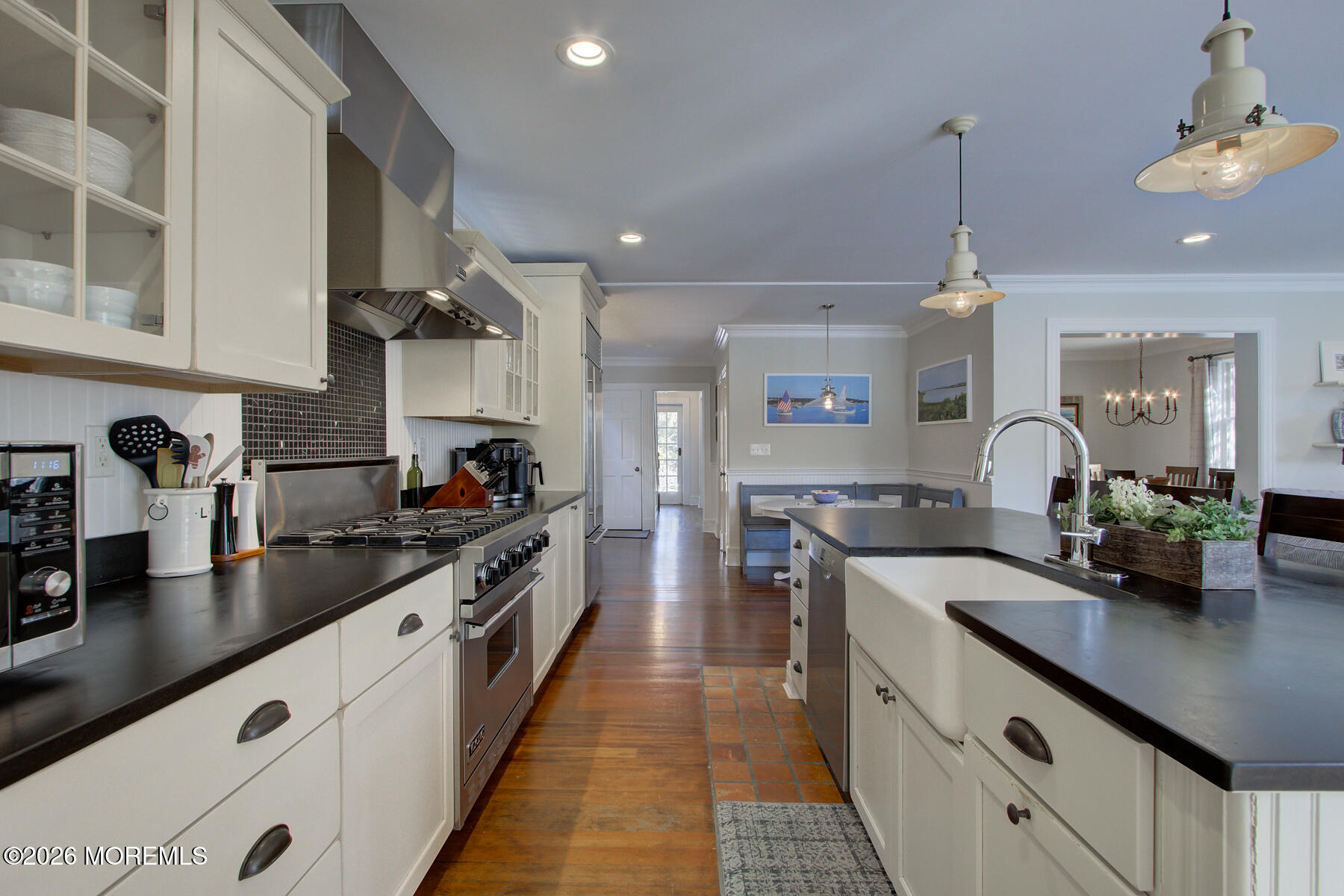 39 River Road Rumson, NJ 07760 - Photo 8 of 36 a large kitchen with kitchen island a sink stainless steel appliances and cabinets