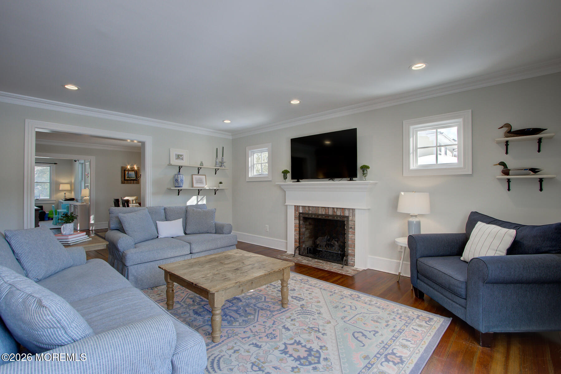 39 River Road Rumson, NJ 07760 - Photo 10 of 36 a living room with furniture a rug and a fireplace