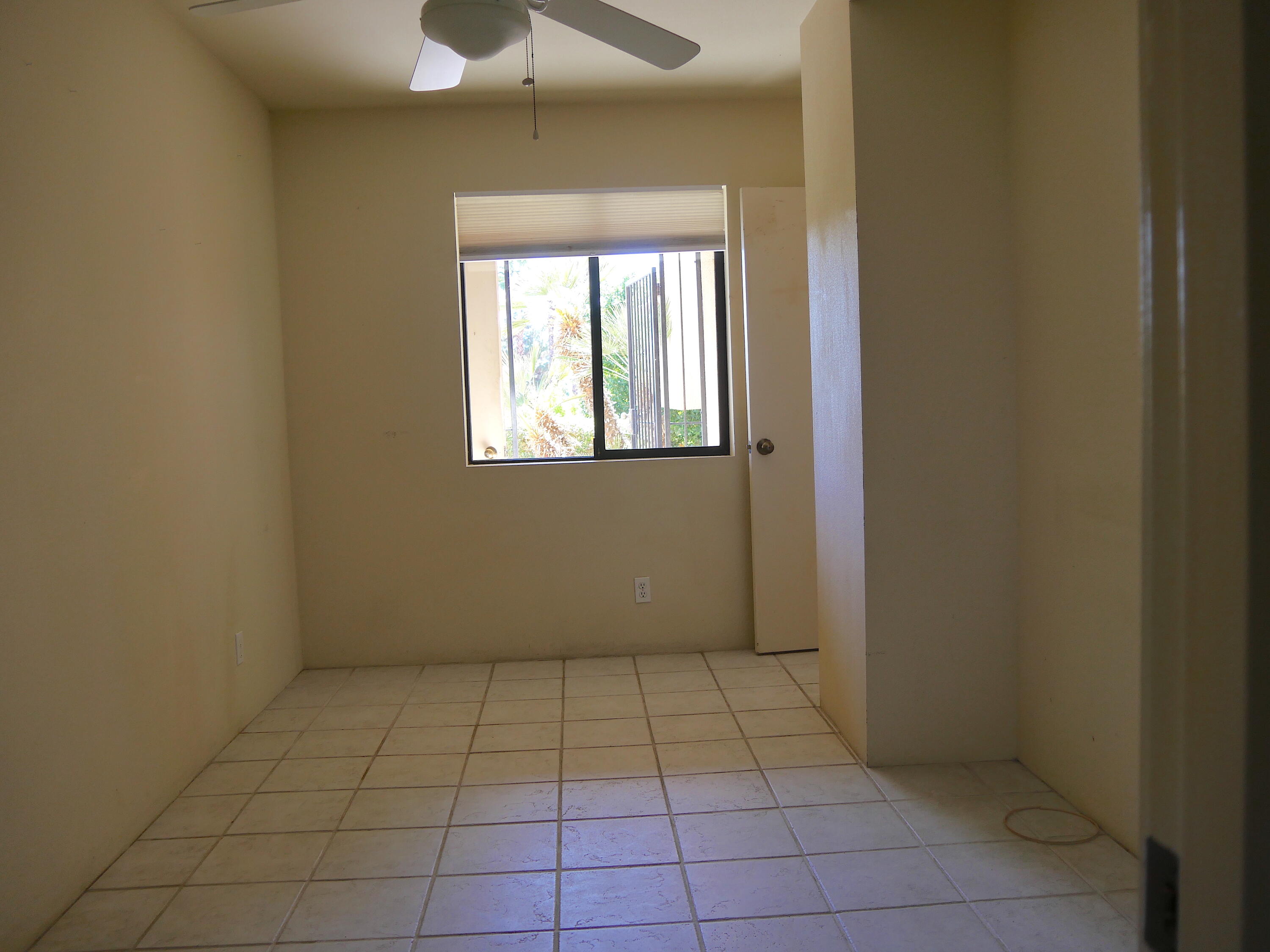 14 Mission Court Rancho Mirage, CA 92270 - Photo 13 of 17 a view of an empty room with a window