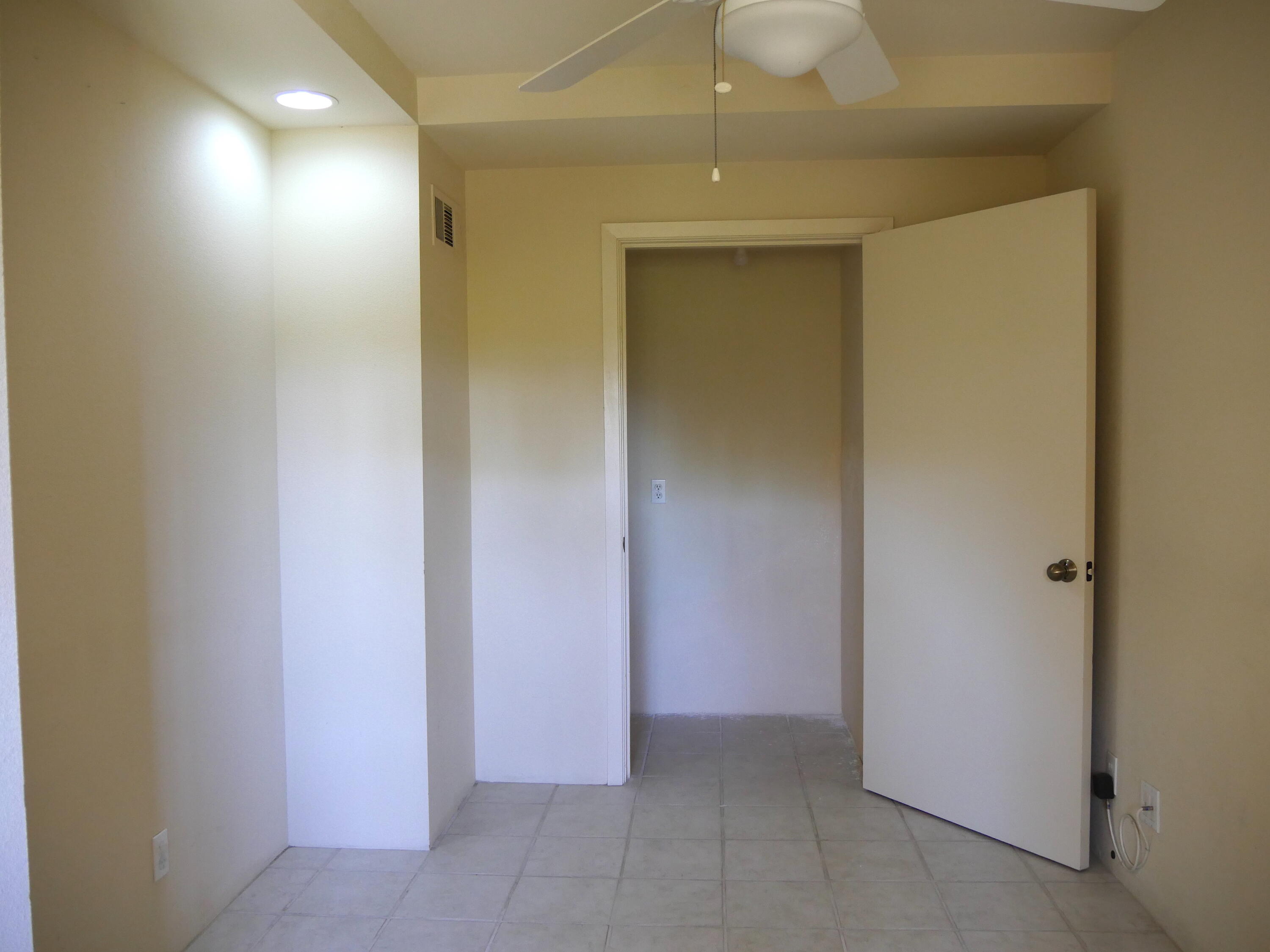 14 Mission Court Rancho Mirage, CA 92270 - Photo 14 of 17 an empty room with hallway view