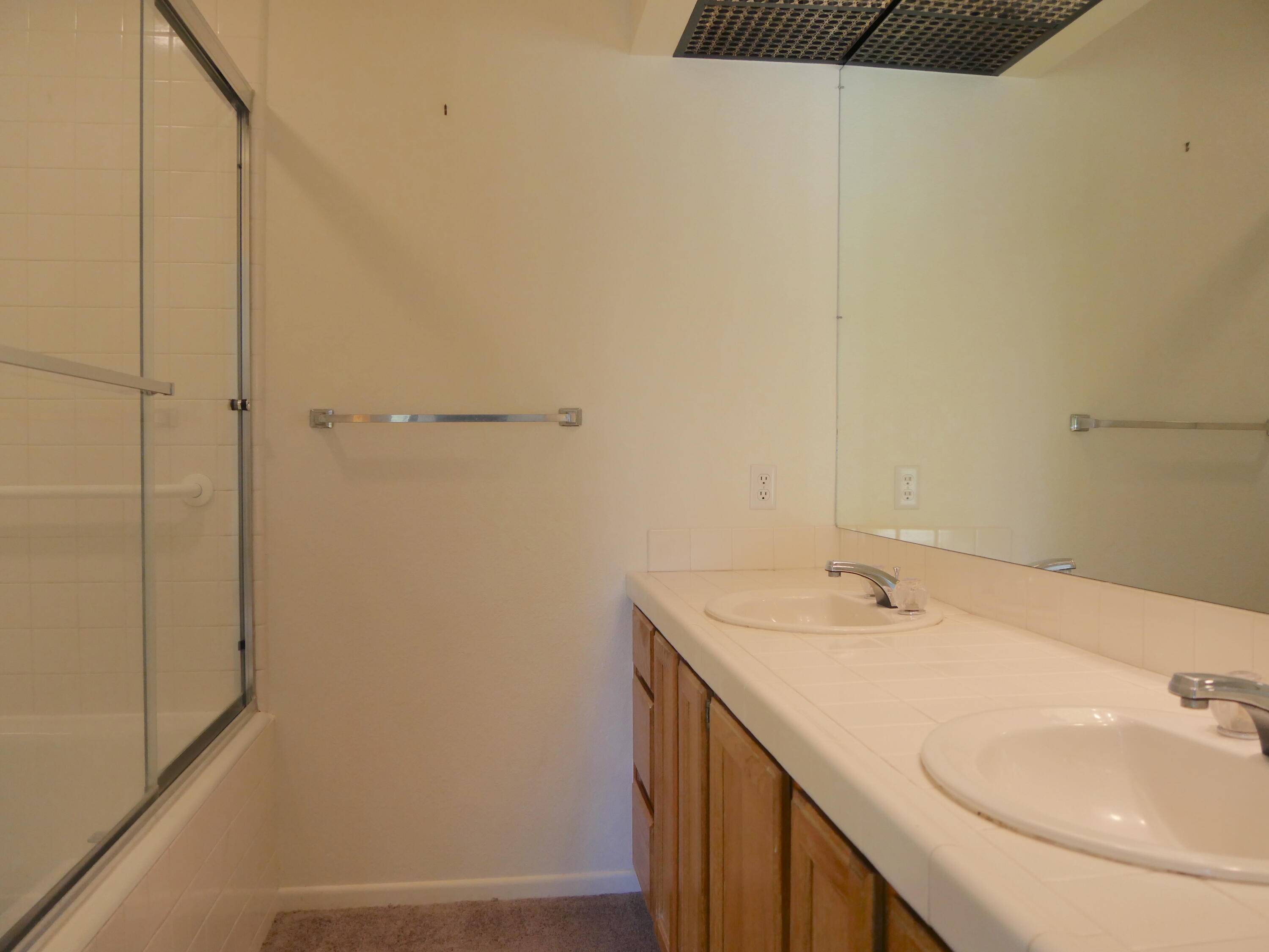14 Mission Court Rancho Mirage, CA 92270 - Photo 15 of 17 a bathroom with a sink and a mirror