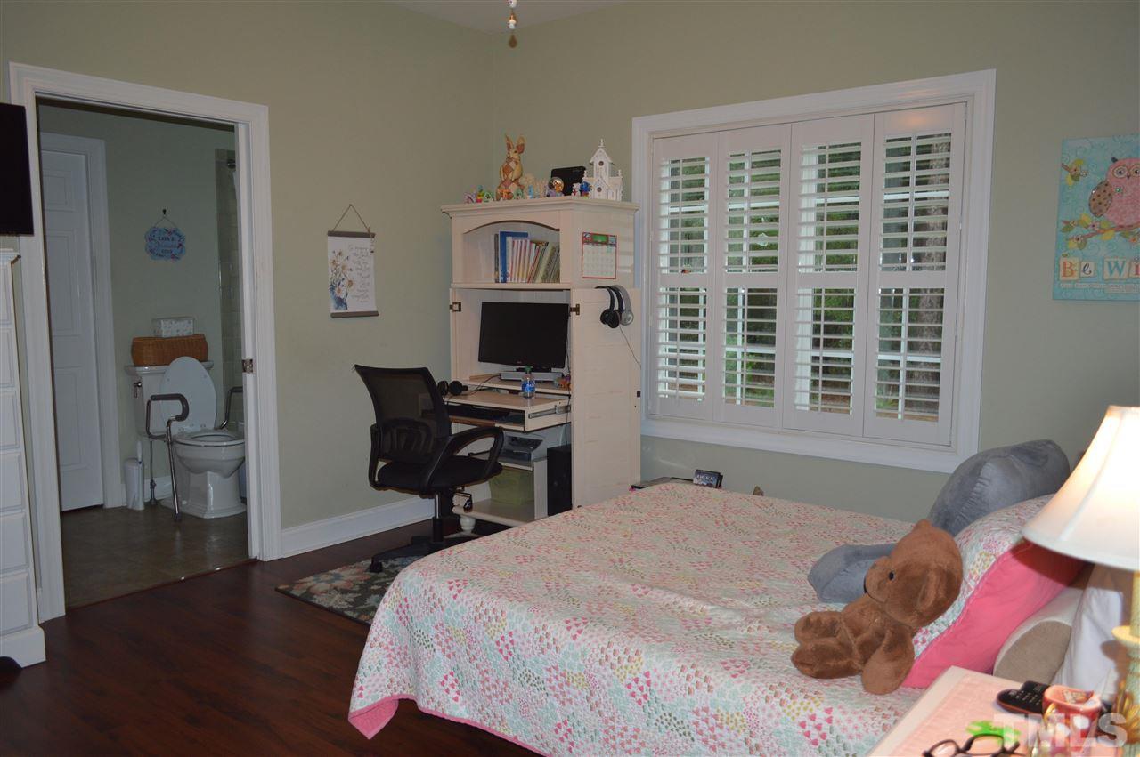 810 Wise Road Dunn, NC 28334 - Photo 22 of 30 a bedroom with a bed and a window