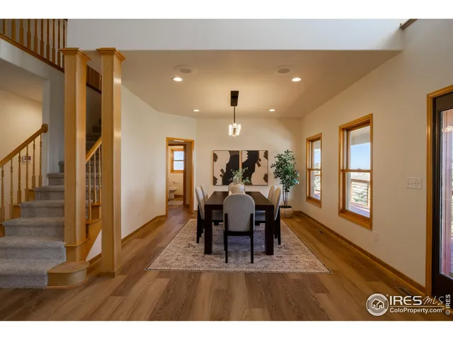 a view of a dining room with furniture window and wooden floor
