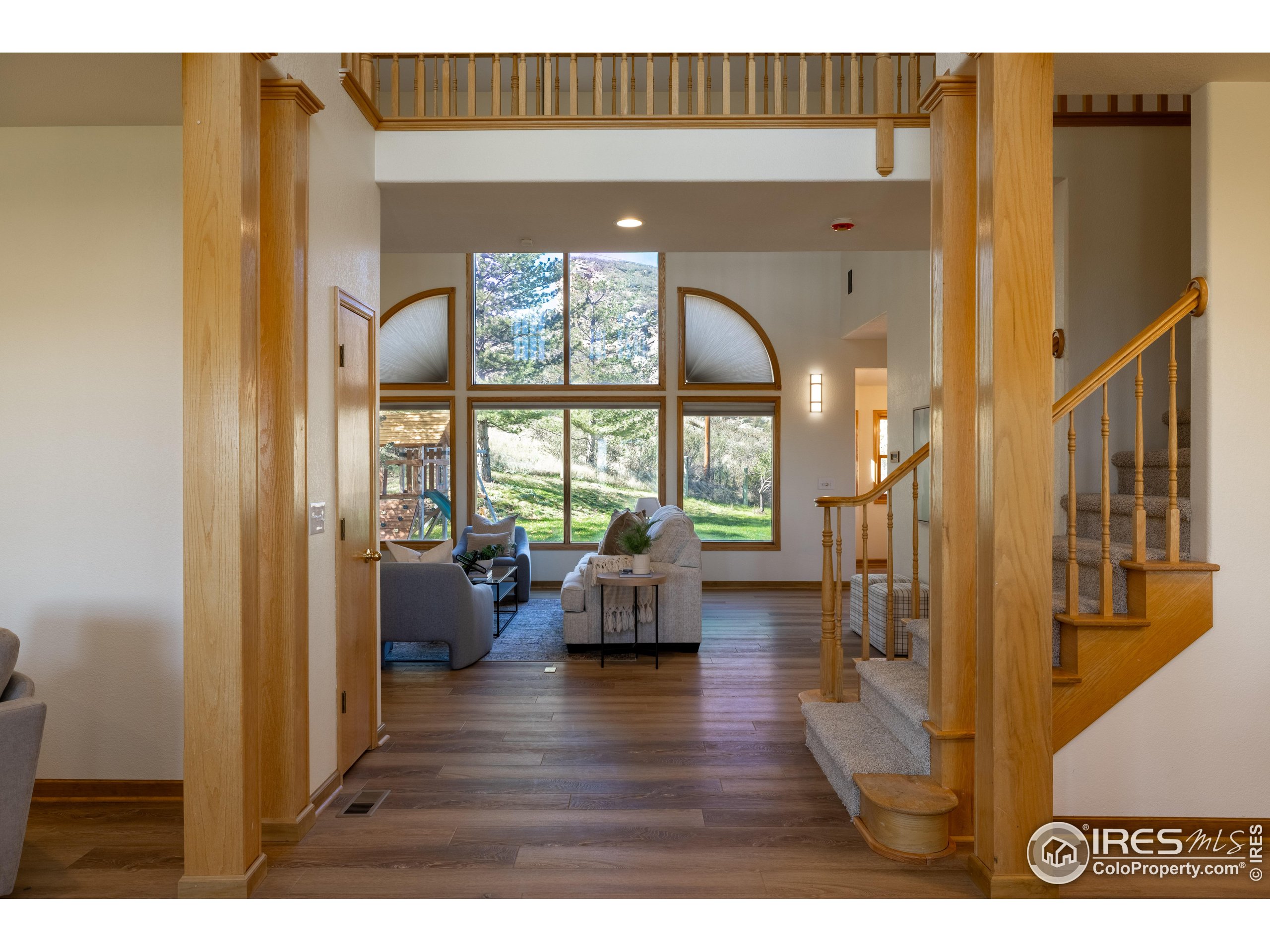 6465 Hidden Springs Road Fort Collins, CO 80526 - Photo 12 of 50 a living room with furniture and a large window