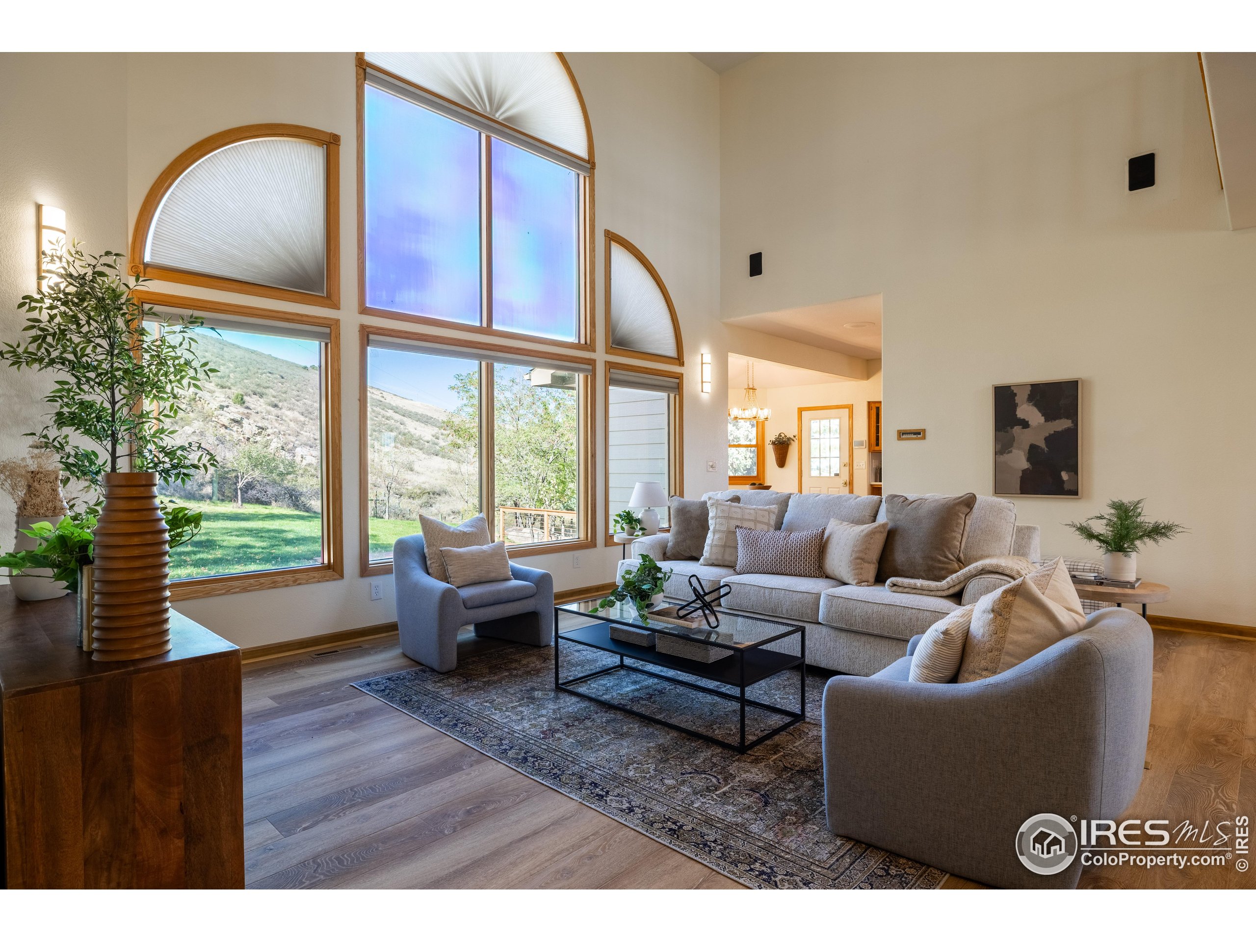 6465 Hidden Springs Road Fort Collins, CO 80526 - Photo 14 of 50 a living room with furniture and a large window