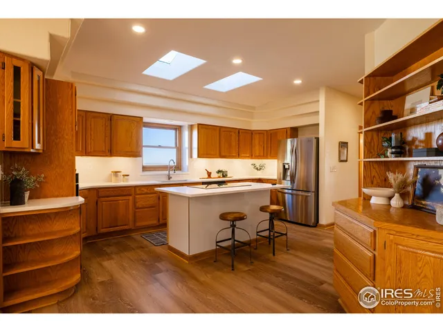 a kitchen with a sink appliances and cabinets