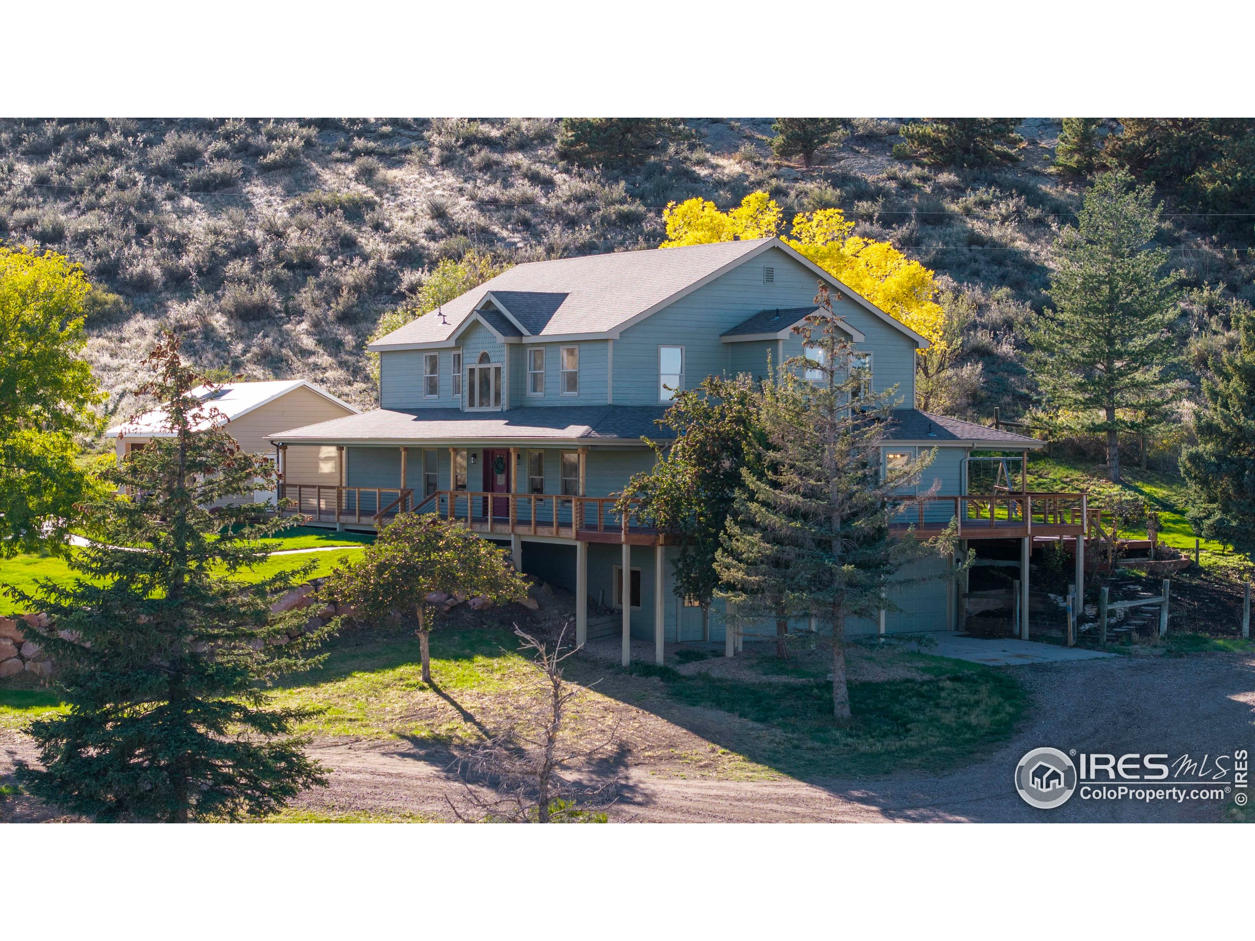 6465 Hidden Springs Road Fort Collins, CO 80526 - Photo 2 of 50 a view of swimming pool and outside seating area