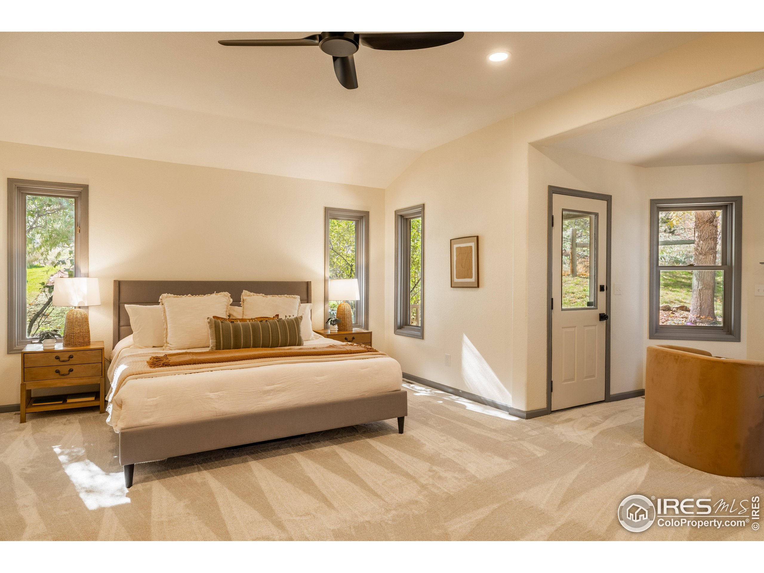 6465 Hidden Springs Road Fort Collins, CO 80526 - Photo 22 of 50 a spacious bedroom with a bed and window