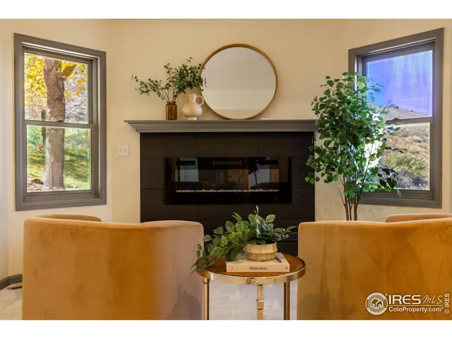 a bathroom with a sink a toilet and large mirror