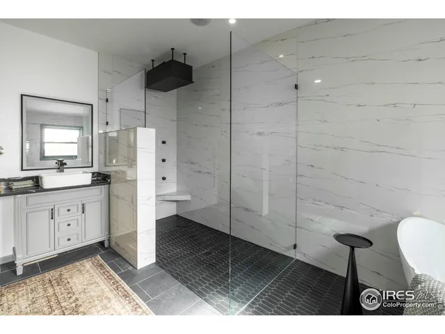 a bath tub sitting in a bathroom next to a window