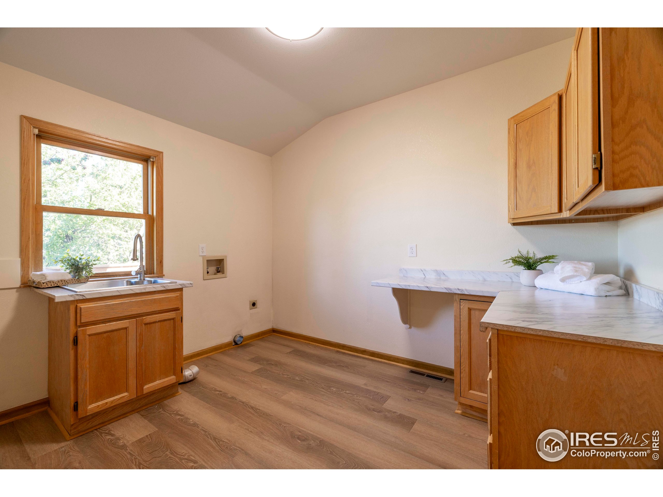 6465 Hidden Springs Road Fort Collins, CO 80526 - Photo 31 of 50 a kitchen with a sink cabinets and a window
