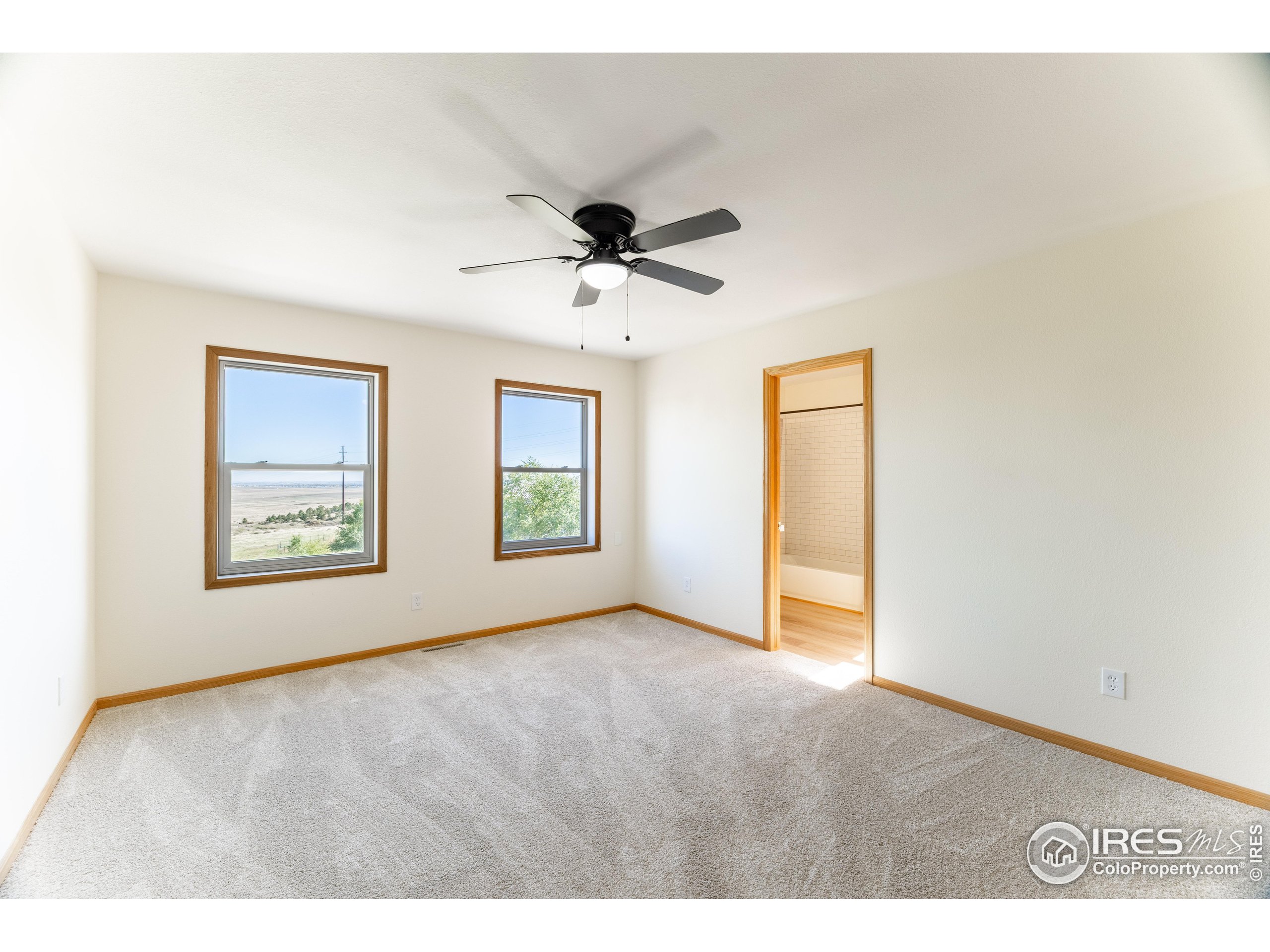 6465 Hidden Springs Road Fort Collins, CO 80526 - Photo 36 of 50 a view of an empty room with a window