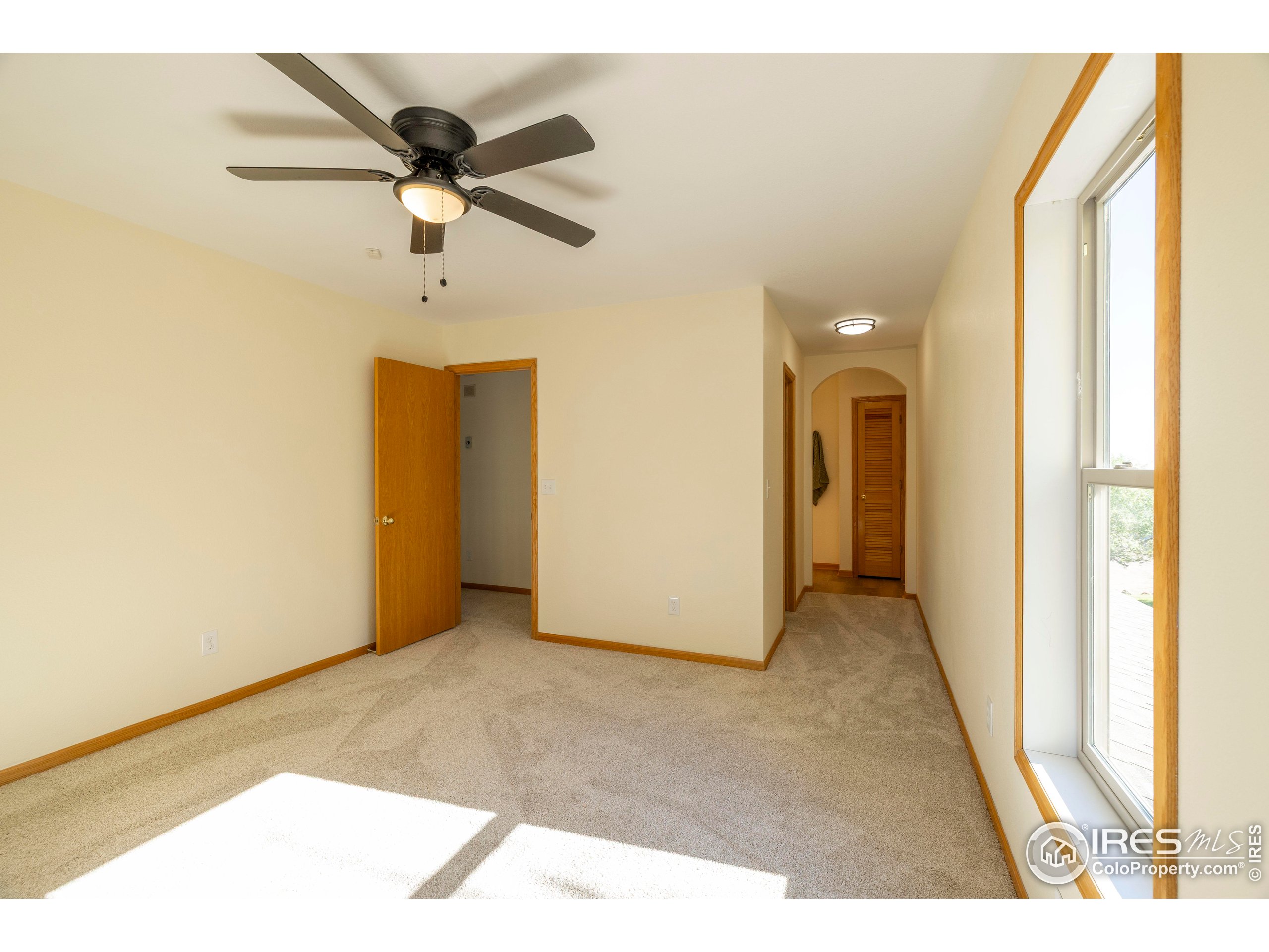 6465 Hidden Springs Road Fort Collins, CO 80526 - Photo 39 of 50 a view of a room with a ceiling fan